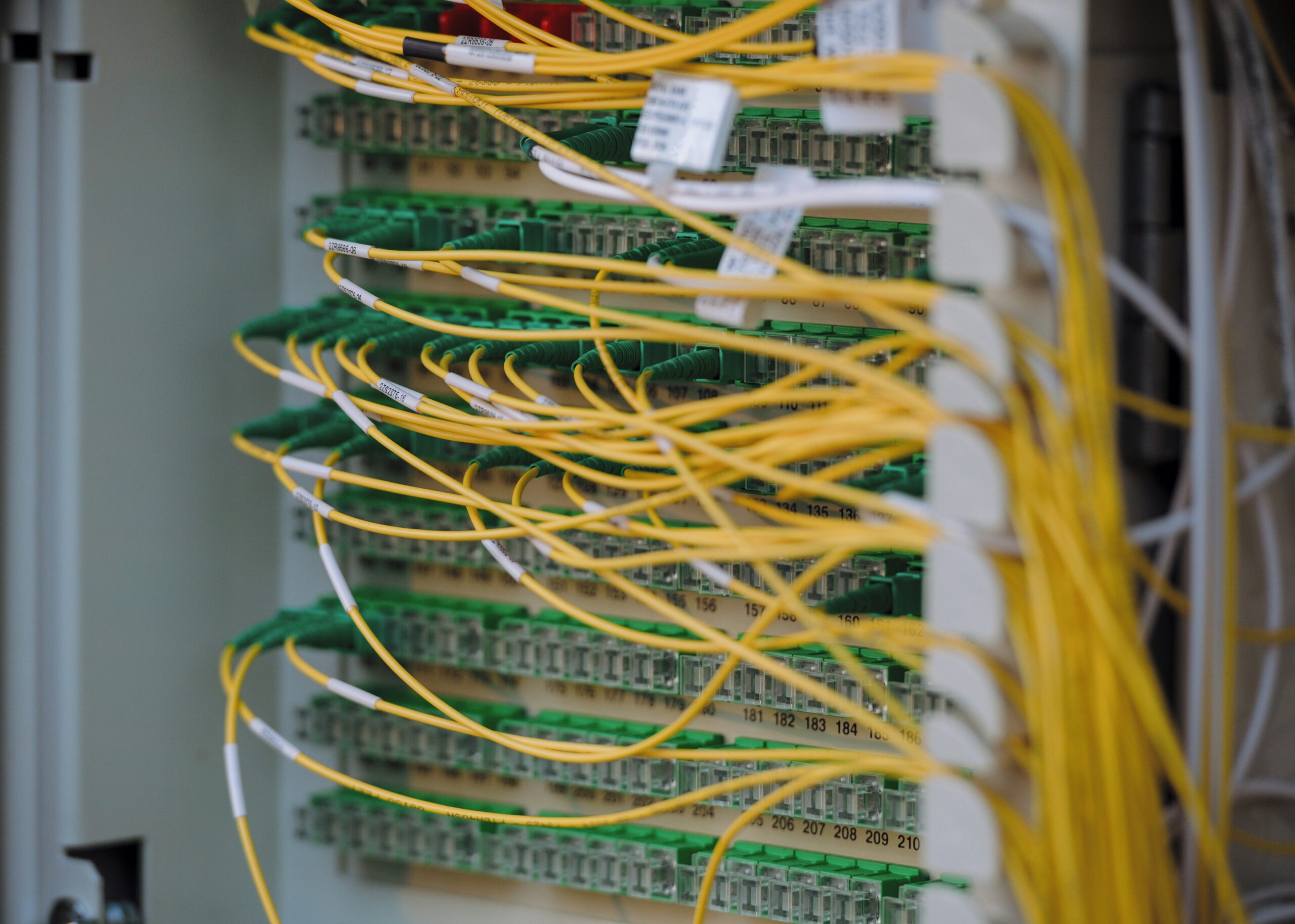 tangled wires connected to server - Fibre optic cables